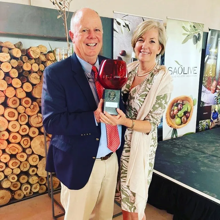 Brenda and Nick of Rio Largo holding a trophy at the SA Olive awards